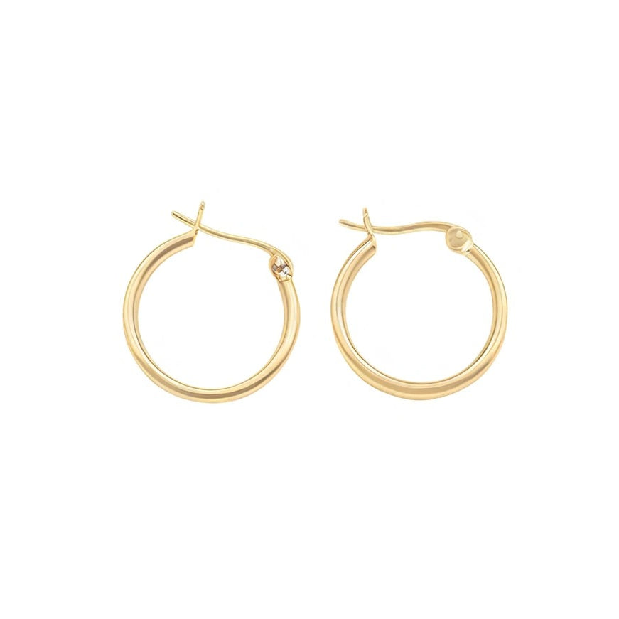 Gold hoop earrings on a white background