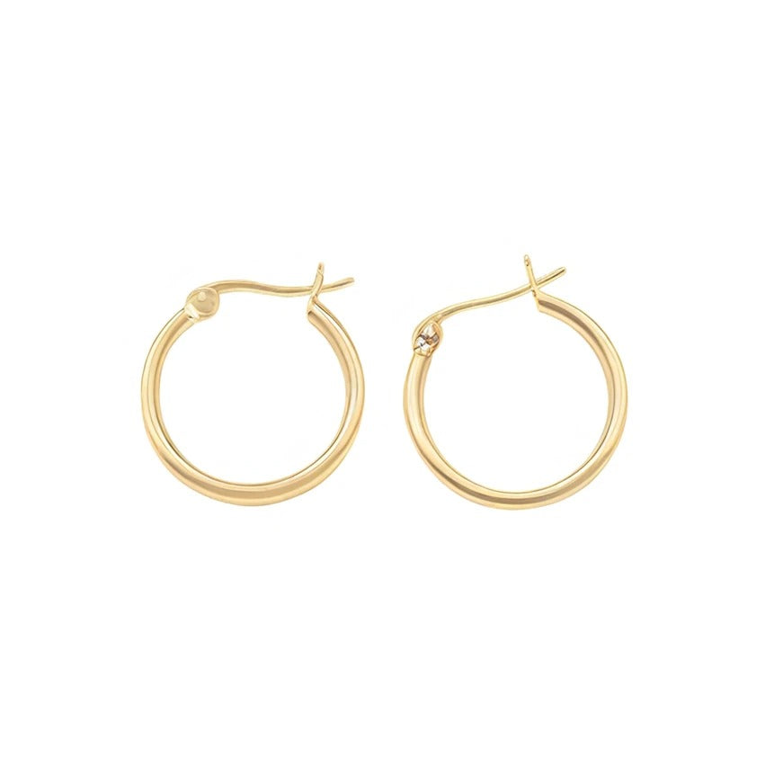 Gold hoop earrings on a white background
