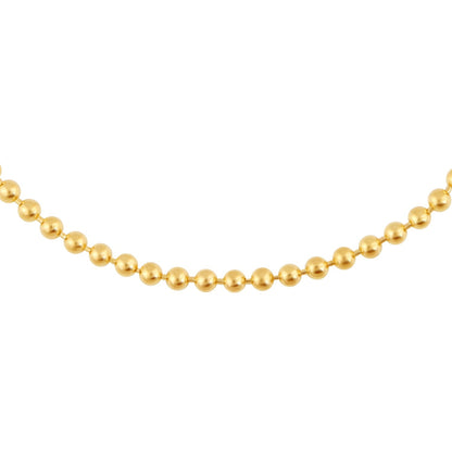Gold ball bracelet on a white background