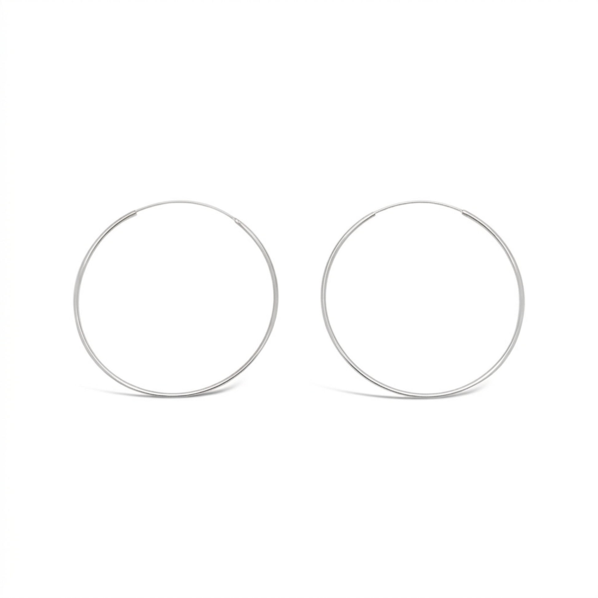 Pair of 50mm 925 sterling silver fine hoop earrings on a clean white background