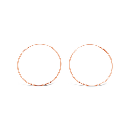 Pair of 50mm 925 sterling silver rose gold fine hoop earrings on a clean white background