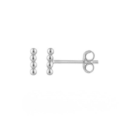 Pair of silver stud earrings on a white background