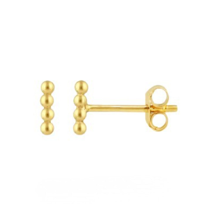 Gold stud earrings on a white background