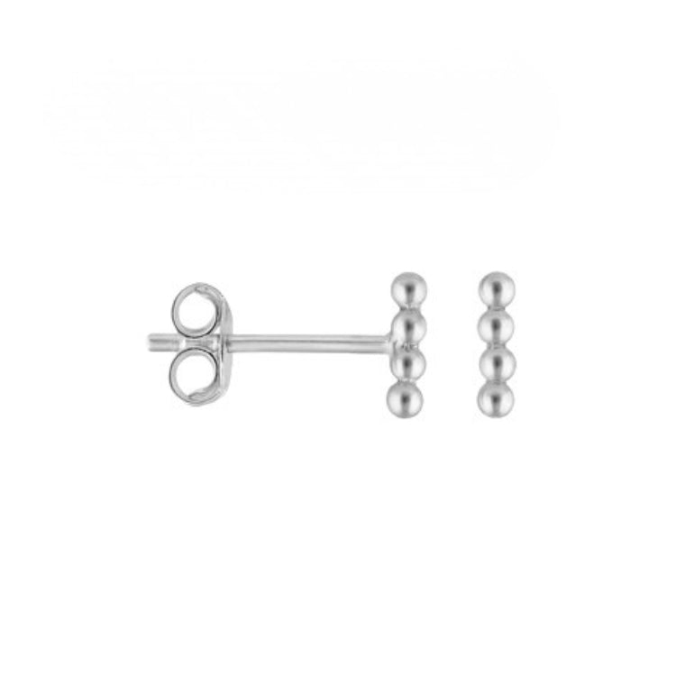 Silver earring on a white background