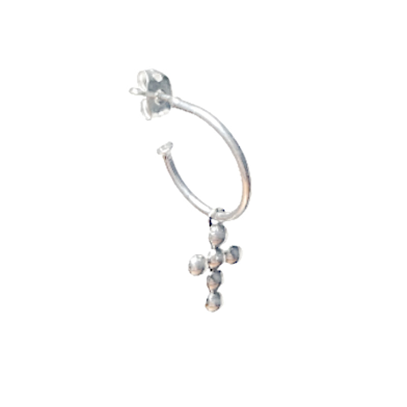 Silver hoop earring with a cross and beads on a white background
