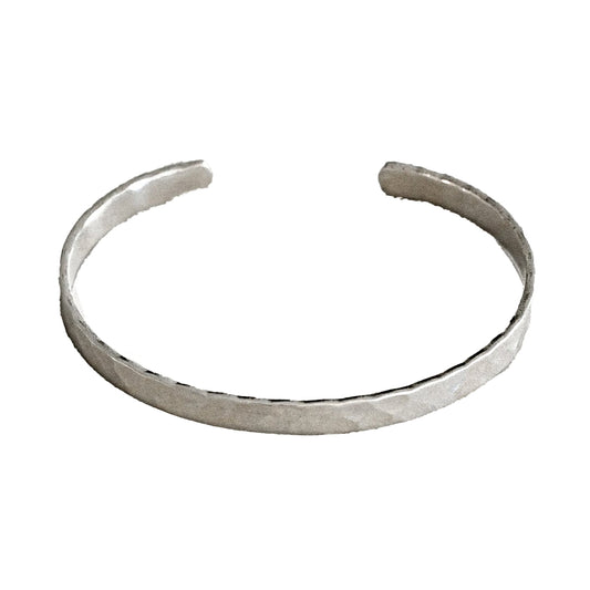 Silver bangle on a white background