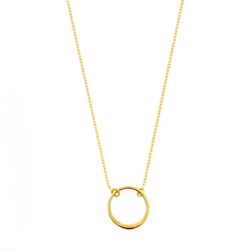 Gold necklace with a simple ring pendant on a white background