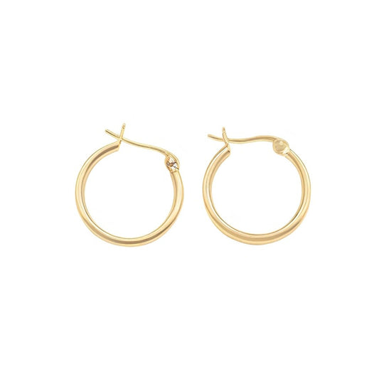 Gold hoop earrings on a white background