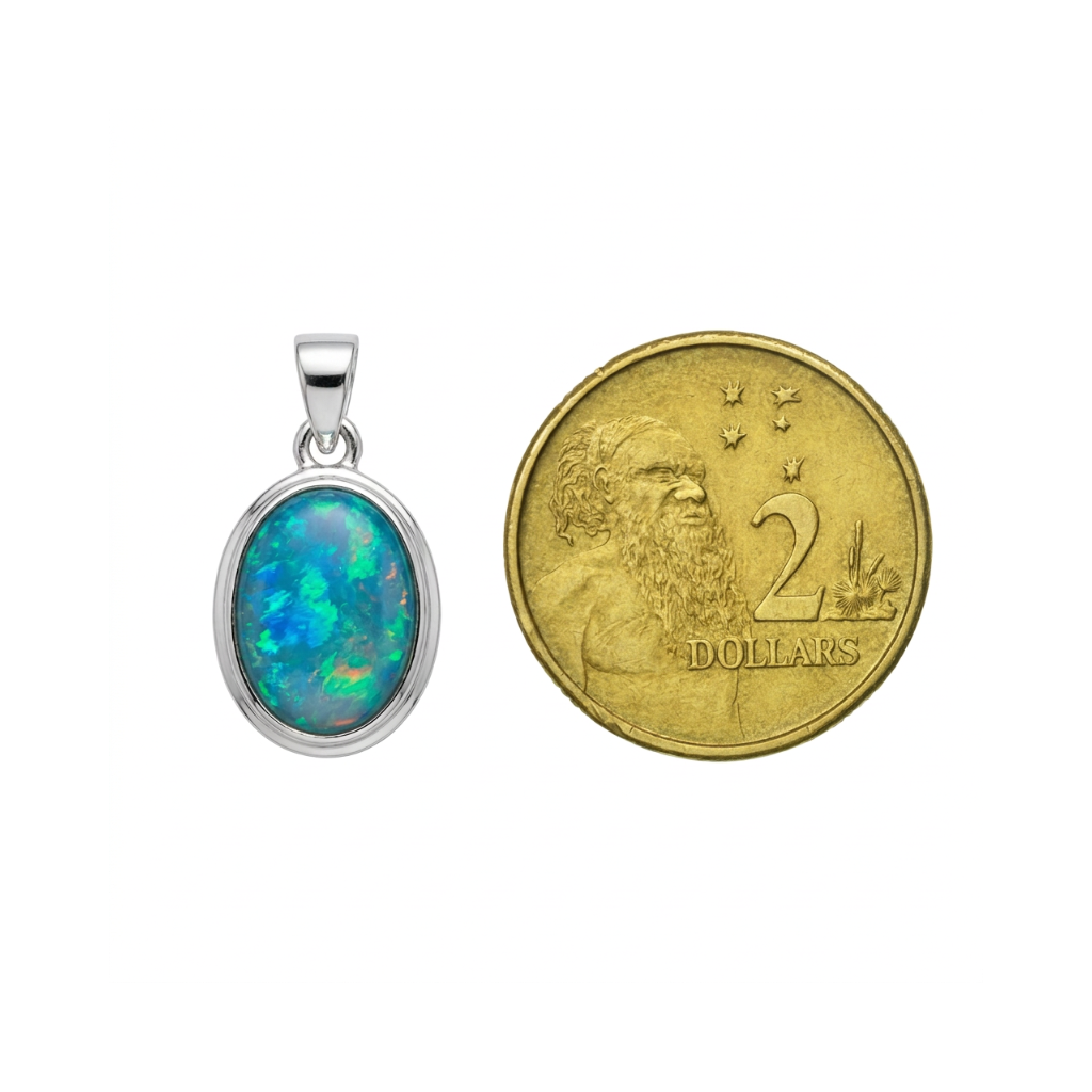 Australian opal pendant size comparison next to Australian two dollar coin for scale