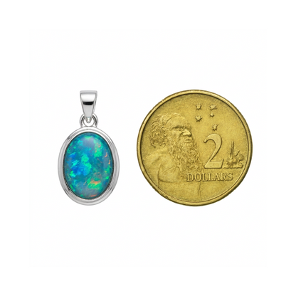 Australian opal pendant size comparison next to Australian two dollar coin for scale